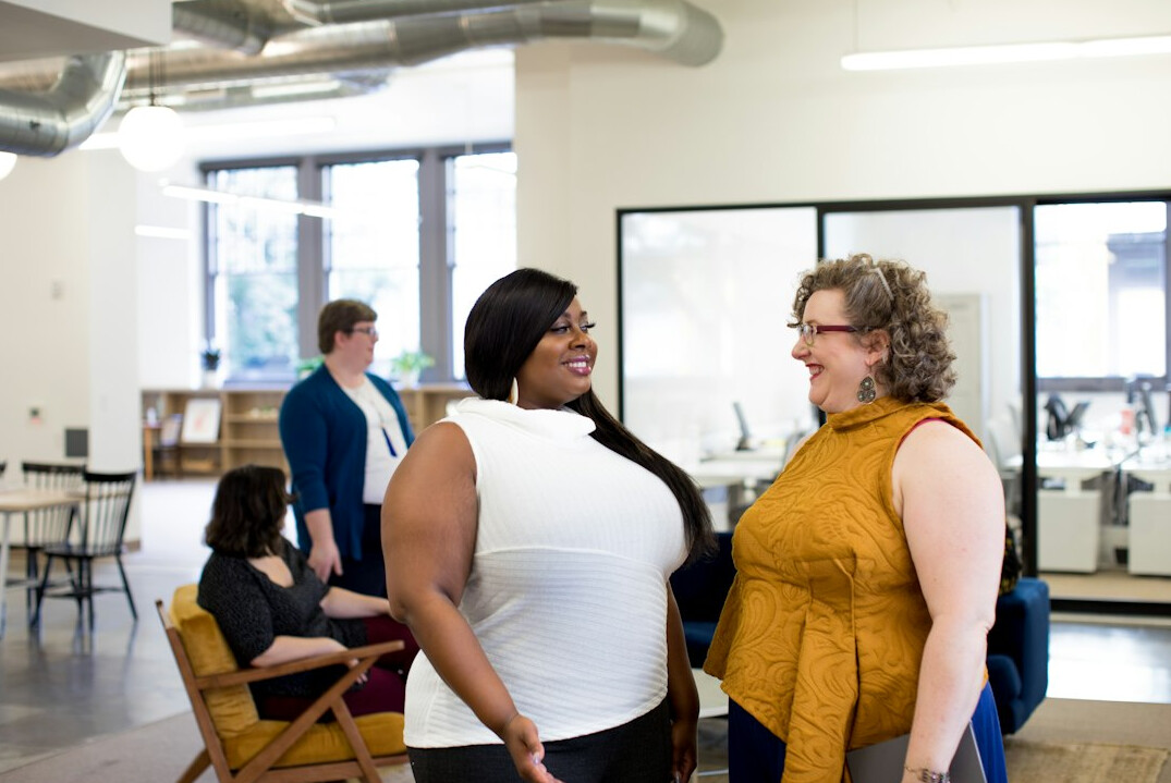 employees smiling in bright office