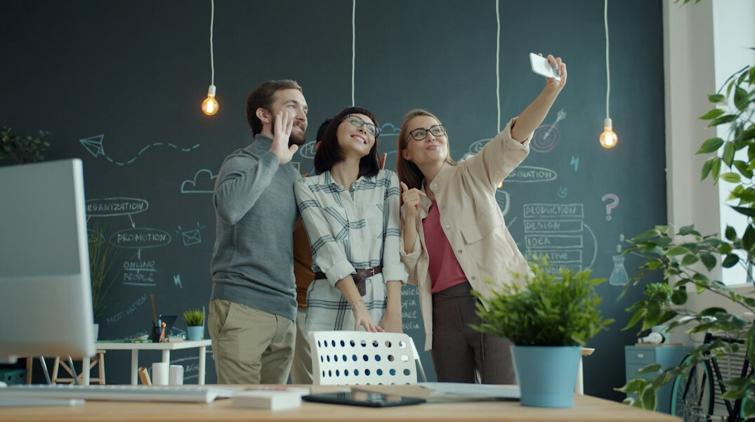 happy diverse team in modern office